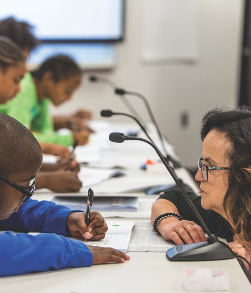 Two children working on a project at a desk